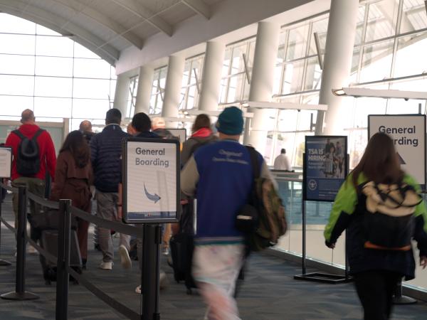 Passengers walking towards security