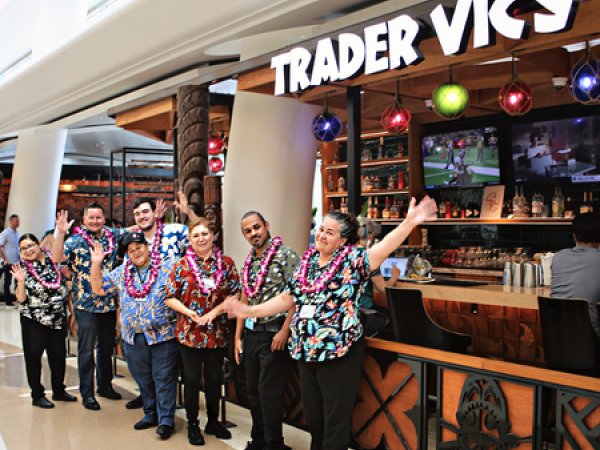 Trader Vic's employees pose and celebrate the first anniversary of Trader Vic's at SJC.