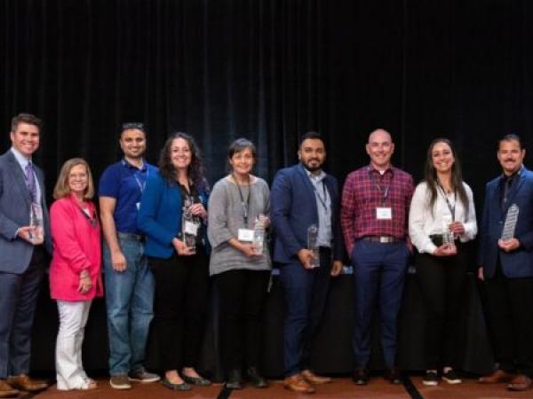 Airport employees accept the John L. Martin award.
