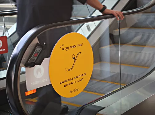 Escalator handrails sanitized with UV-C light