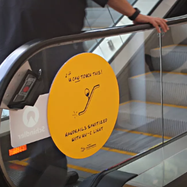 Escalator handrails sanitized with UV-C light