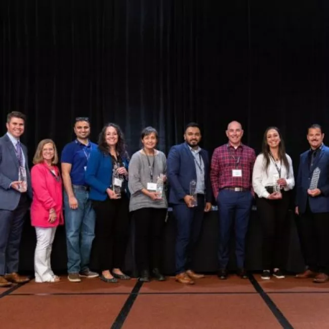 Airport employees accept the John L. Martin award.