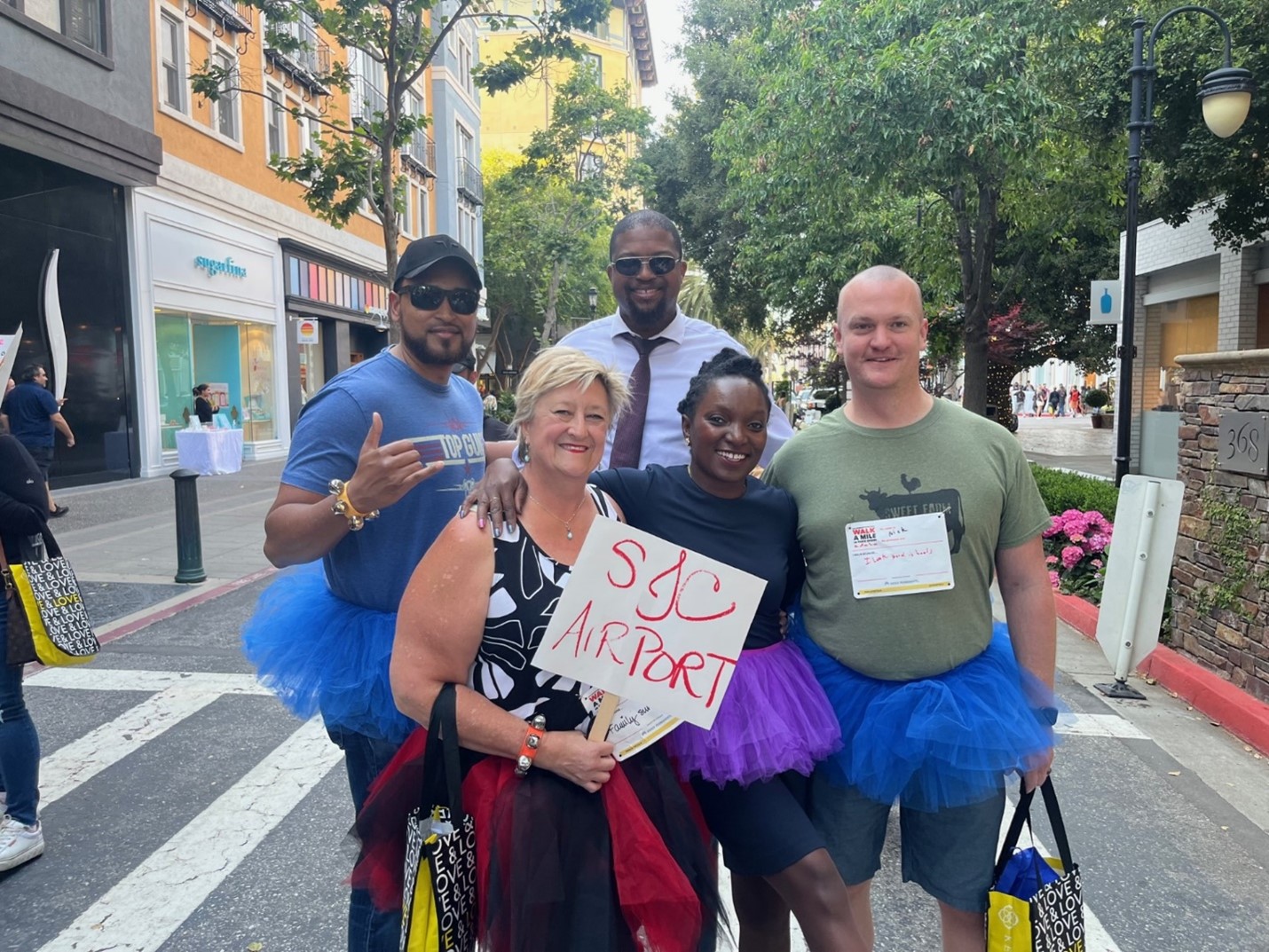 SJC employees walk in heels in Walk a Mile in Their Shoes.